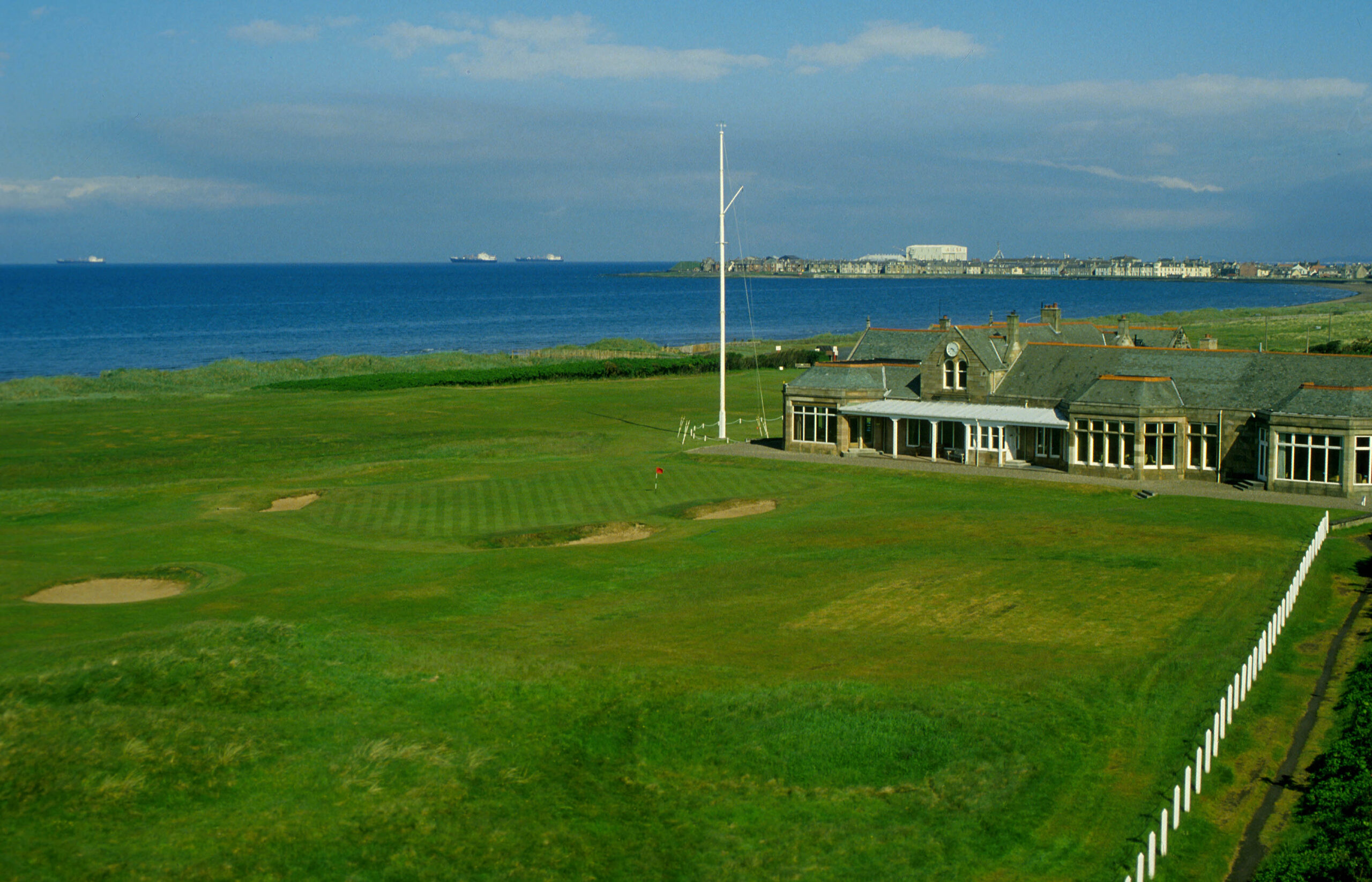 Looking down on to the 18th green and clubhouse at the royal troon golf course, South Ayrshire, Scotland.