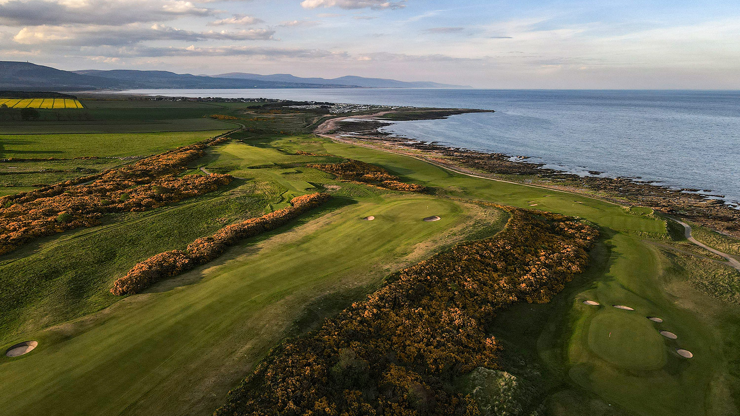 An aerial view of the 7th hole at Royal Dornoch Golf Club, Championship Course.